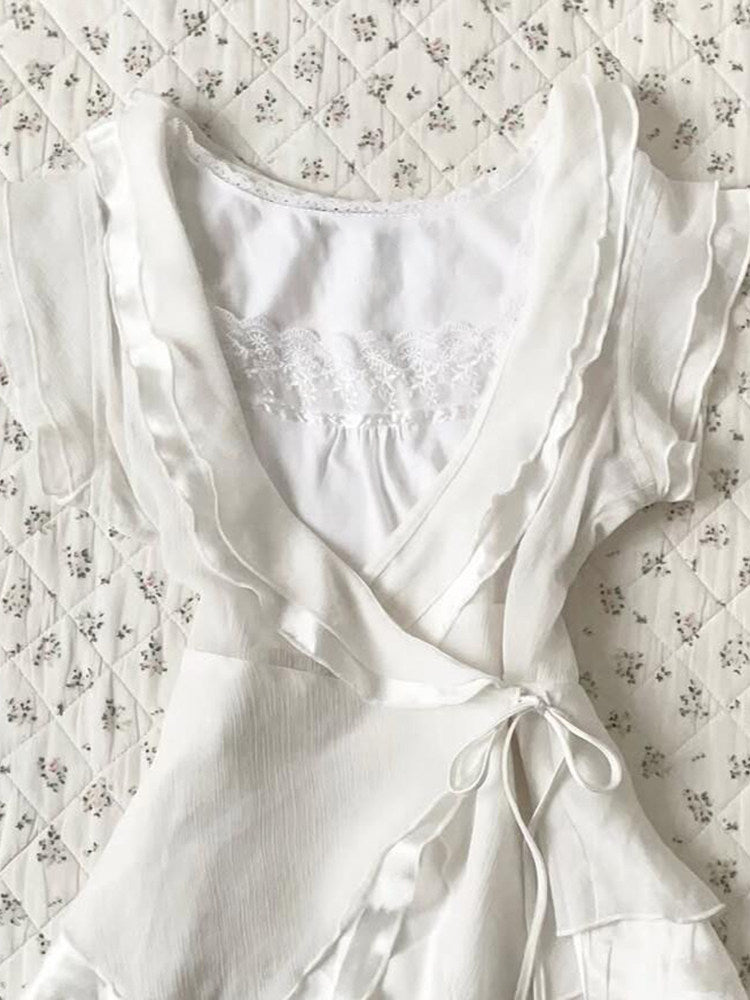 white ruffled v-neck shirt