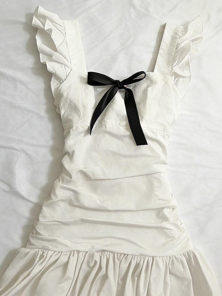 black bow suspender white dress