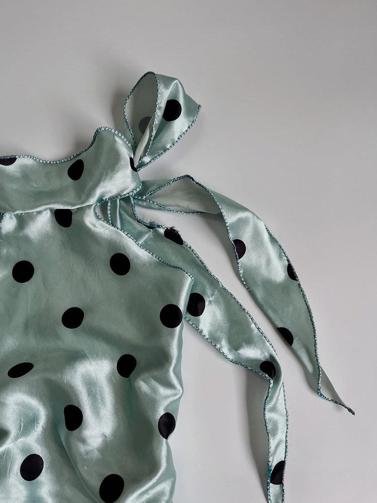 green polka dots top