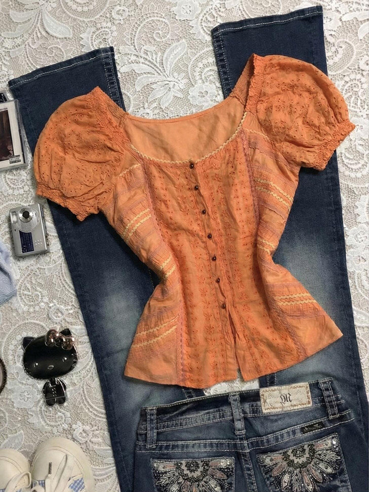 orange puff-sleeved shirt