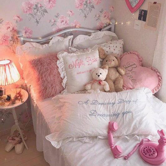 ruffled white embroidered cotton pillowcase