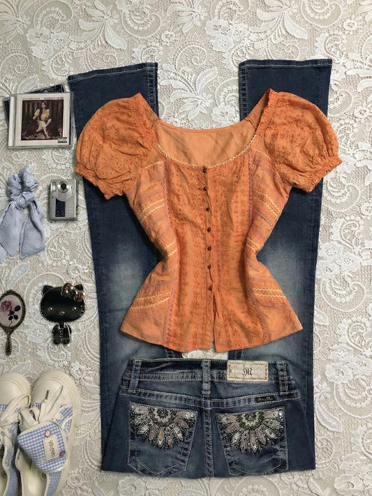 orange puff-sleeved shirt