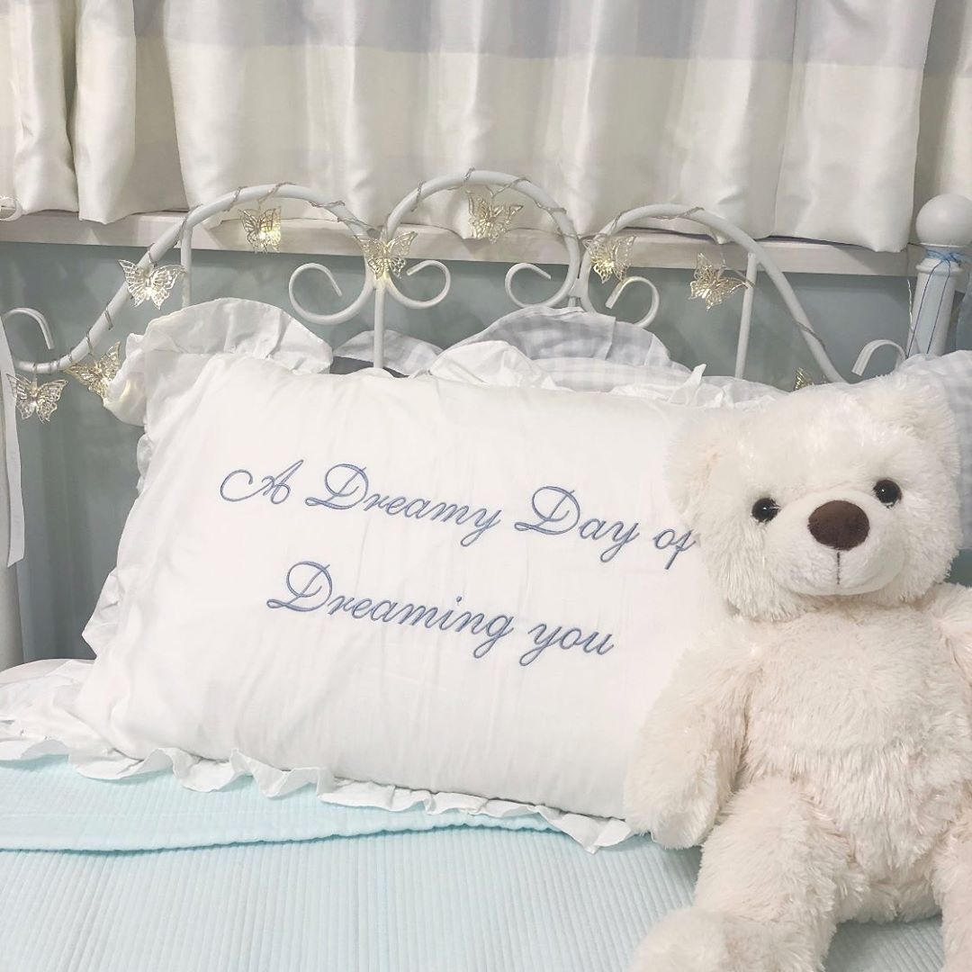 ruffled white embroidered cotton pillowcase