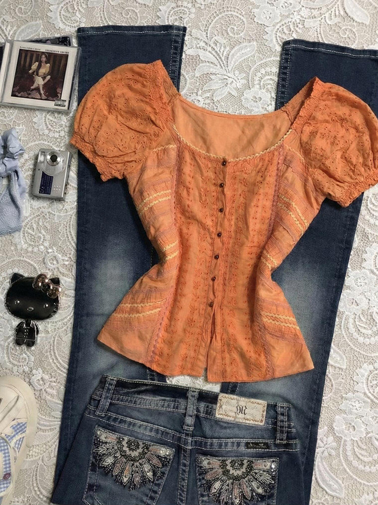 orange puff-sleeved shirt