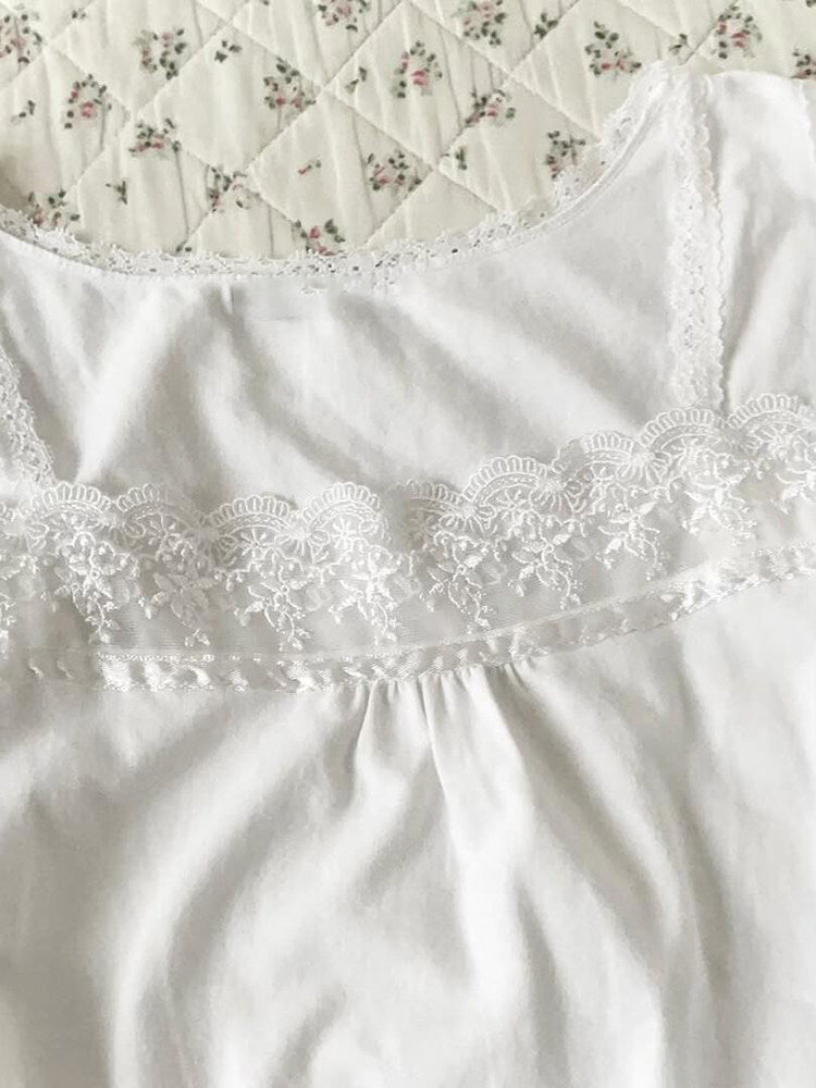 white ruffled v-neck shirt