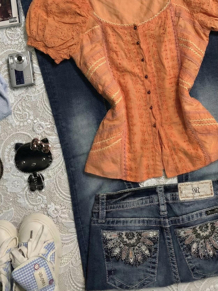 orange puff-sleeved shirt