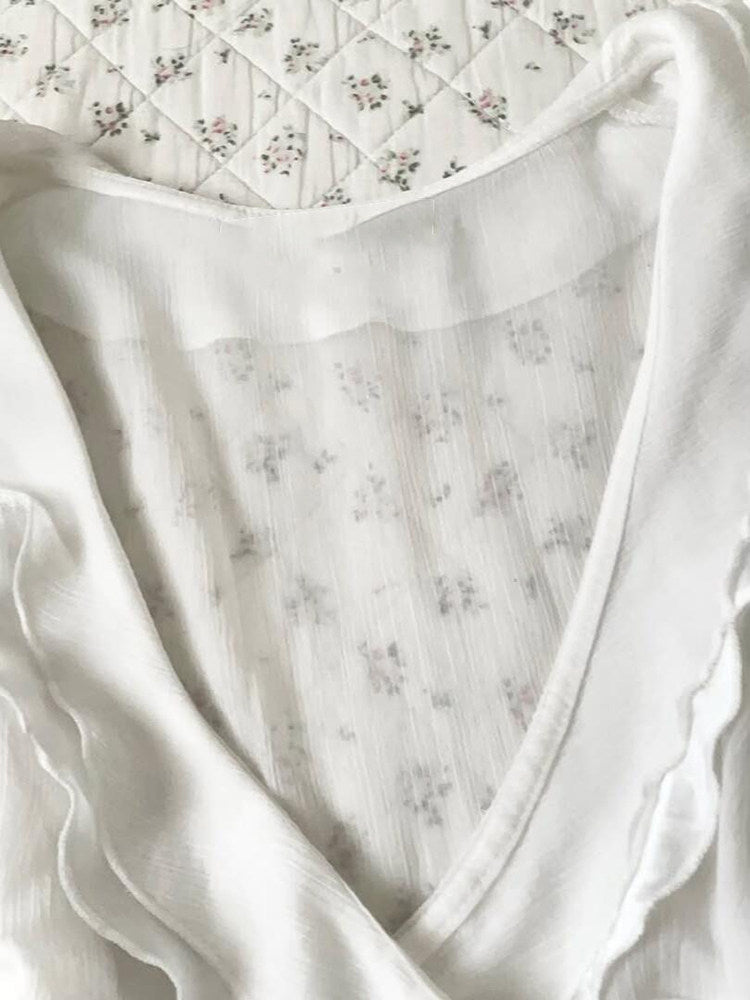 white ruffled v-neck shirt