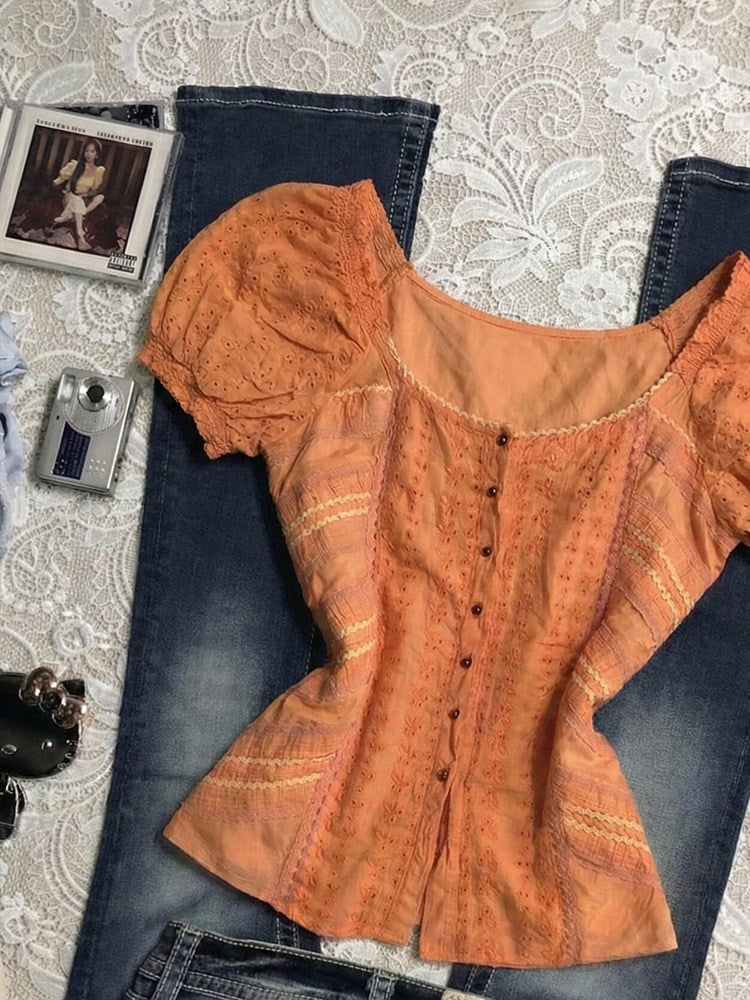 orange puff-sleeved shirt