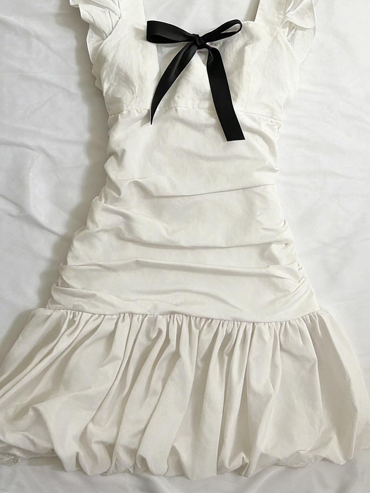 black bow suspender white dress