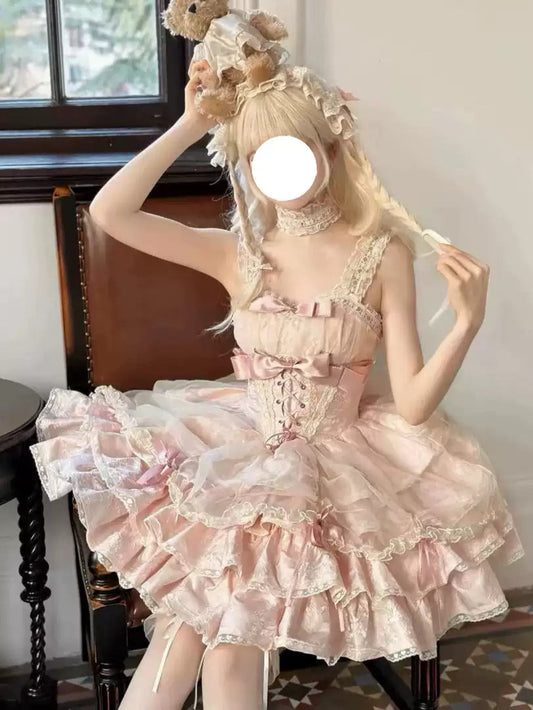 Person wearing a pink lace dress holding a teddy bear in a room with a window.
