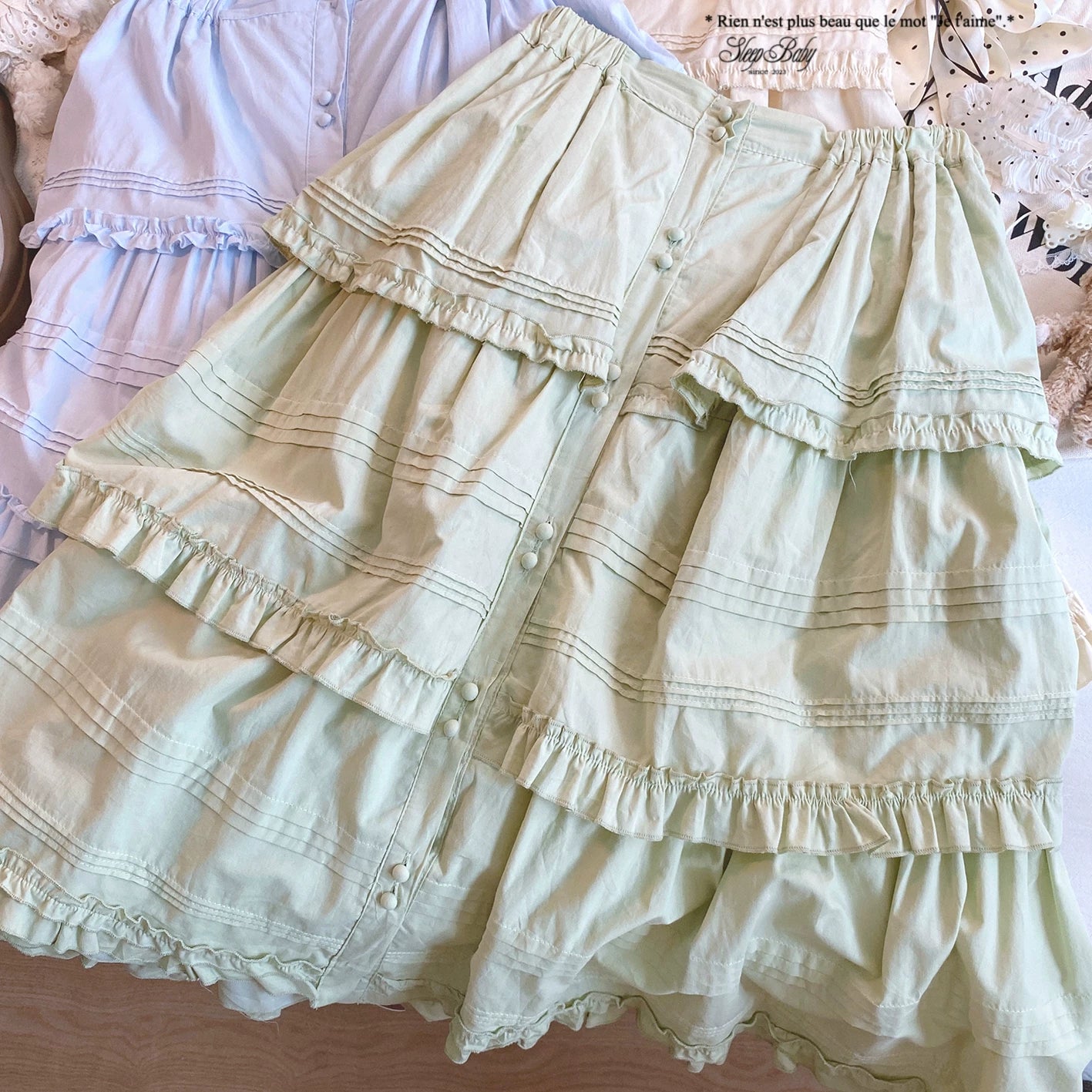 sleepdoll Handmade “Miao Hua Zhi Yuan” Woodland-Inspired Single-Button Sweet Solid Color Pleated Tiered Ruffle Skirt